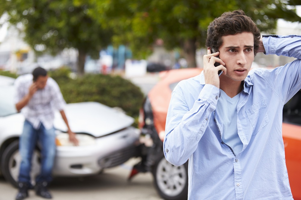 motorists make phone calls after auto collision