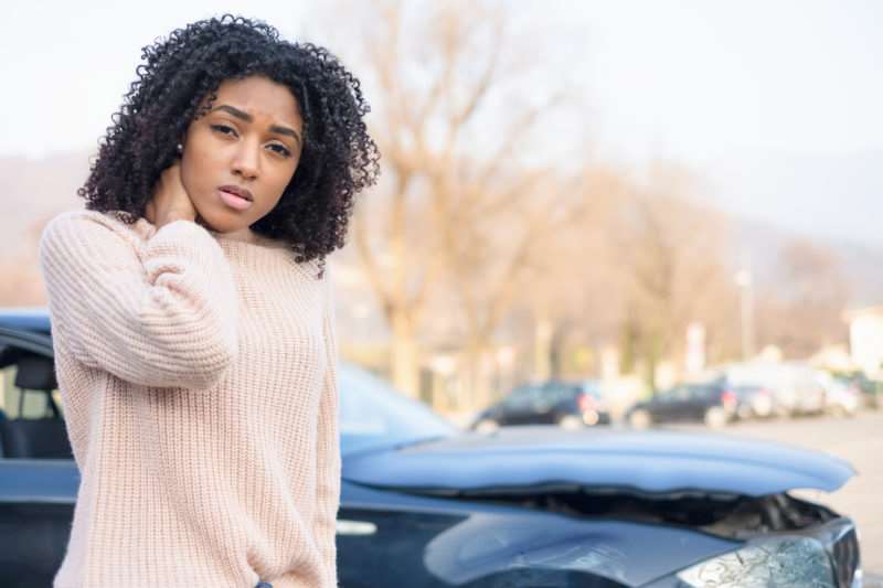 a woman experiencing an injury after a car accident in Charleston, SC