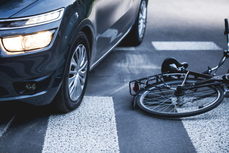 a car after hitting a cyclist