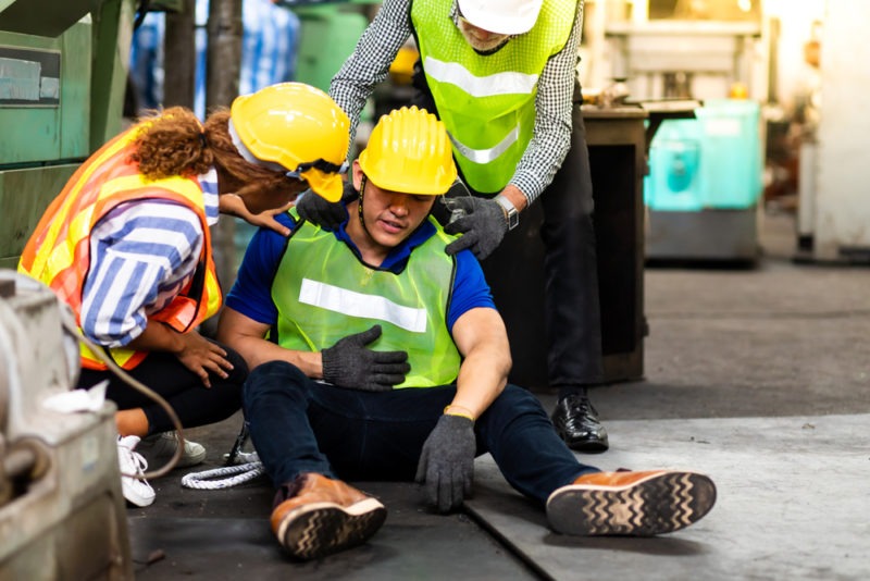 an injured worker being attended to by others