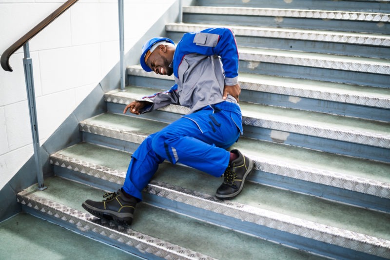 laborer-with-back-pain-after-fall-on-stairs