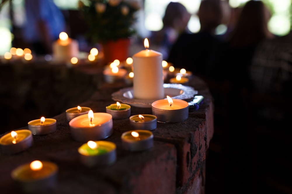 Monck Corner wrongful death lawyer at an indoor funeral with candles.