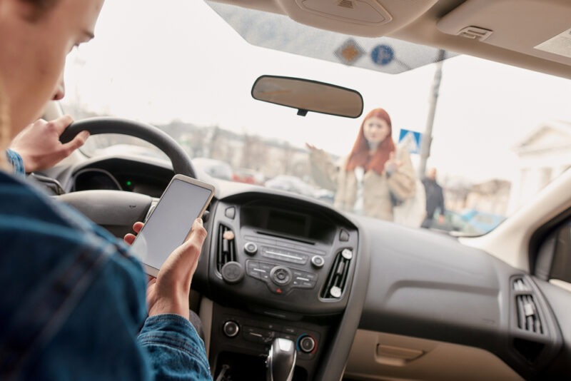 A woman about to get hit by a distracted driver needs to hire a Greenville pedestrian accident lawyer.