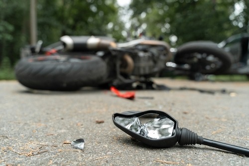 A motorcycle crashed on a highway, a scene where a Charleston motorcycle accident lawyer can assist with legal claims.